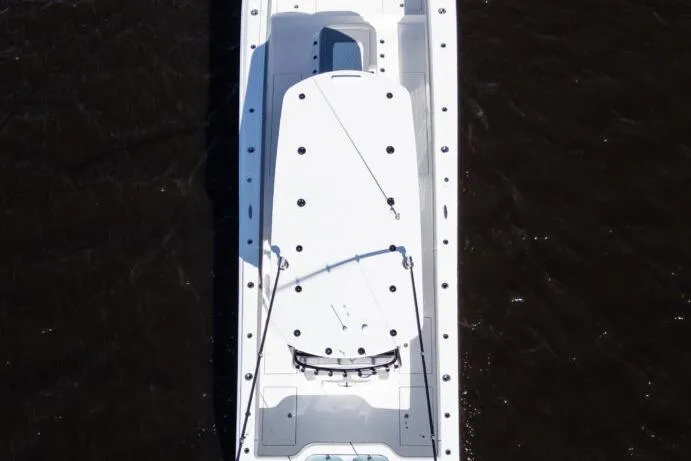 Slide: The Image of Aerial view of a 2026 Front Runner 37 Catamaran on dark water. - 3