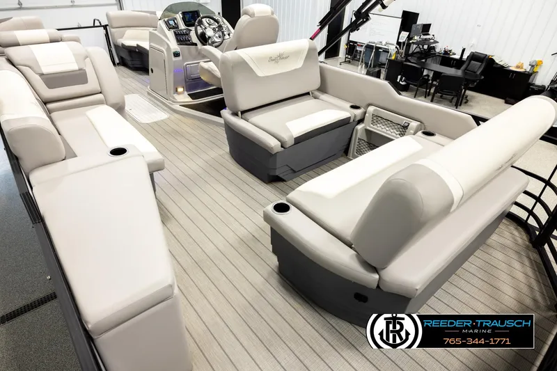 Slide: The Image of 2023 SunChaser 23 Eclipse SSB pontoon boat interior with luxurious seating and modern helm. - 12
