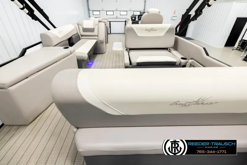 Slide: The Image of 2023 SunChaser 23 Eclipse SSB pontoon boat interior with beige seating and modern design. - 17