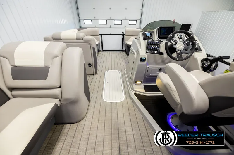 Slide: The Image of Interior of 2023 SunChaser 23 Eclipse SSB boat with modern seating and control panel. - 18