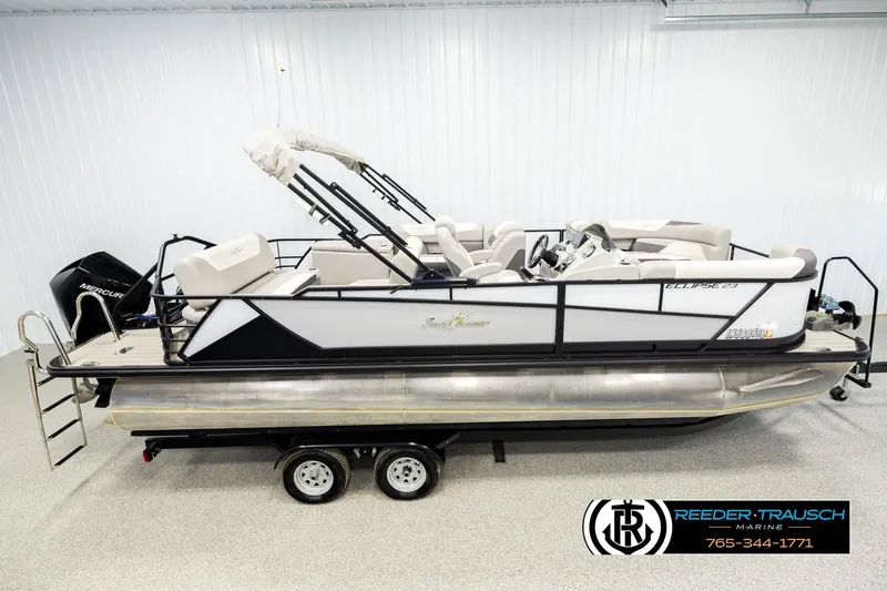 Slide: The Image of 2023 SunChaser 23 Eclipse SSB pontoon boat on trailer in showroom. - 2