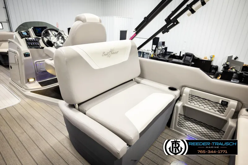 Slide: The Image of 2023 SunChaser 23 Eclipse SSB boat interior with plush seating and modern dashboard. - 23