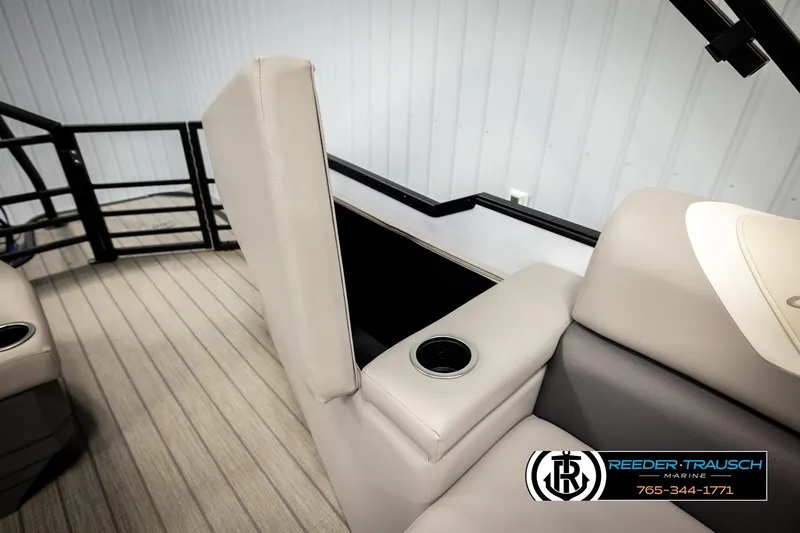 Slide: The Image of 2023 SunChaser 23 Eclipse SSB boat interior with beige seating and cup holder. - 28