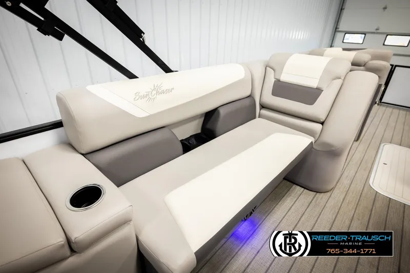 Slide: The Image of 2023 SunChaser 23 Eclipse SSB boat interior with plush seating and cup holder. - 29