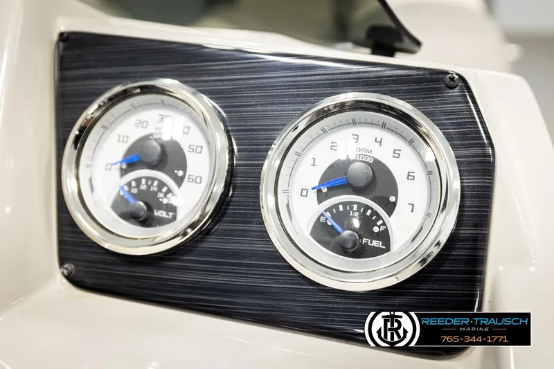 Slide: The Image of Dashboard gauges of 2023 SunChaser 23 Eclipse SSB boat, featuring volt and fuel indicators. - 38