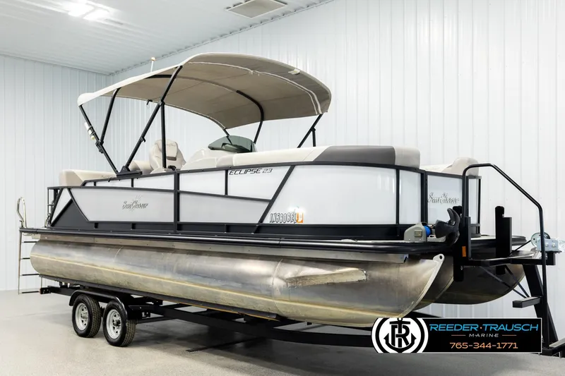 Slide: The Image of 2023 SunChaser 23 Eclipse SSB pontoon boat on trailer in indoor showroom. - 4