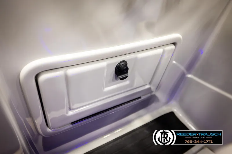 Slide: The Image of Storage compartment on 2023 SunChaser 23 Eclipse SSB boat, featuring sleek design and secure latch. - 41