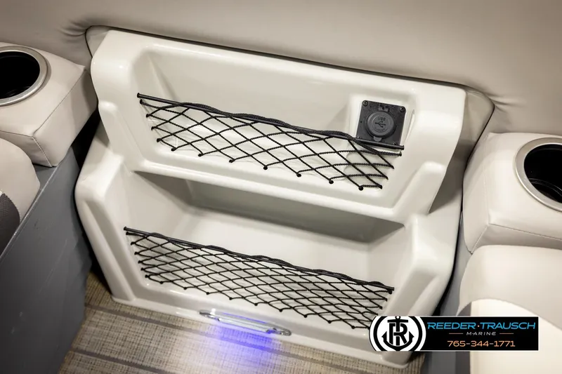 Slide: The Image of 2023 SunChaser 23 Eclipse SSB boat interior with storage nets and USB port. - 46