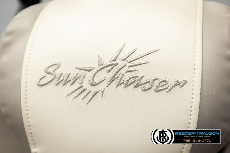 Slide: The Image of SunChaser 23 Eclipse SSB 2023 logo on beige upholstery, Reeder-Trausch Marine branding. - 48