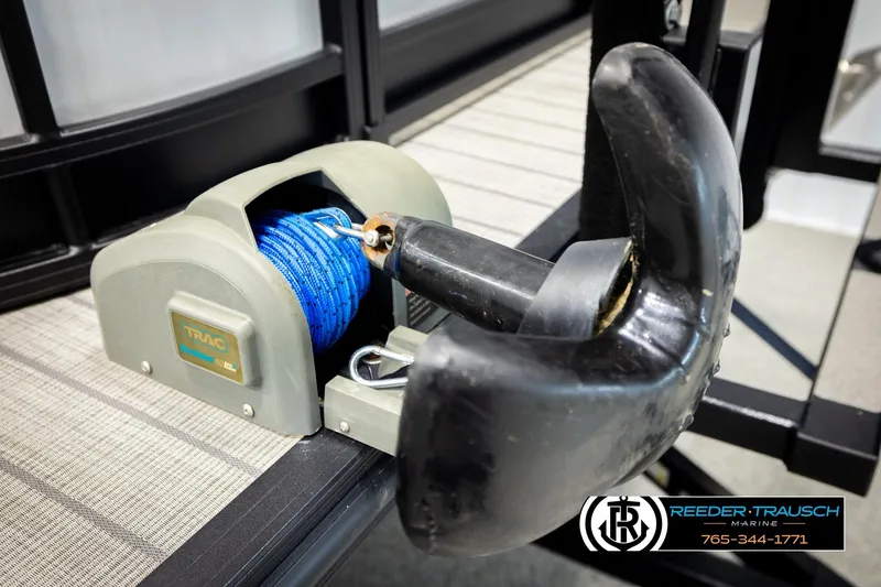 Slide: The Image of Electric anchor winch on 2023 SunChaser 23 Eclipse SSB boat, featuring blue rope and black anchor. - 55