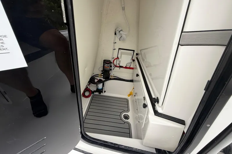 Slide: The Image of Interior view of 2026 Tidewater 2500 Carolina Bay boat compartment with equipment. - 37