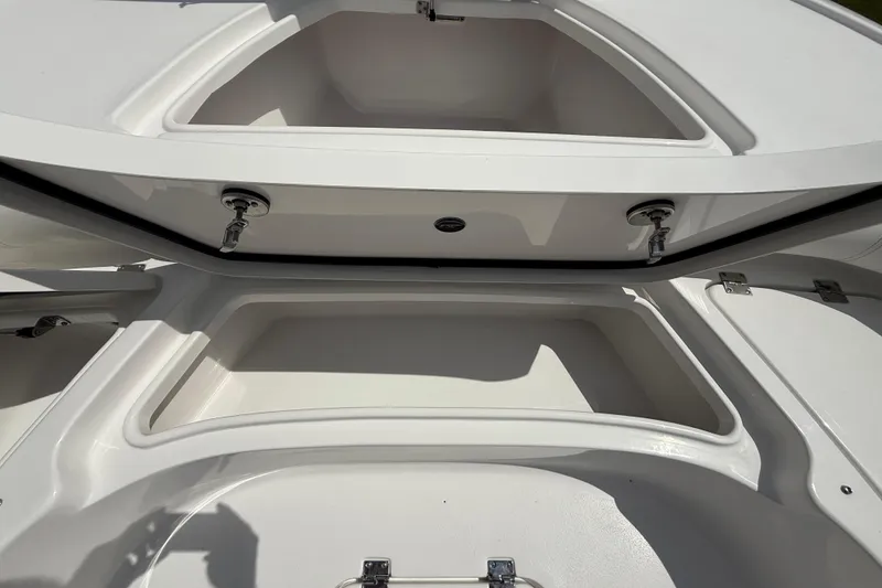 Slide: The Image of 2026 Tidewater 2500 Carolina Bay boat storage compartments, open and spacious design. - 42