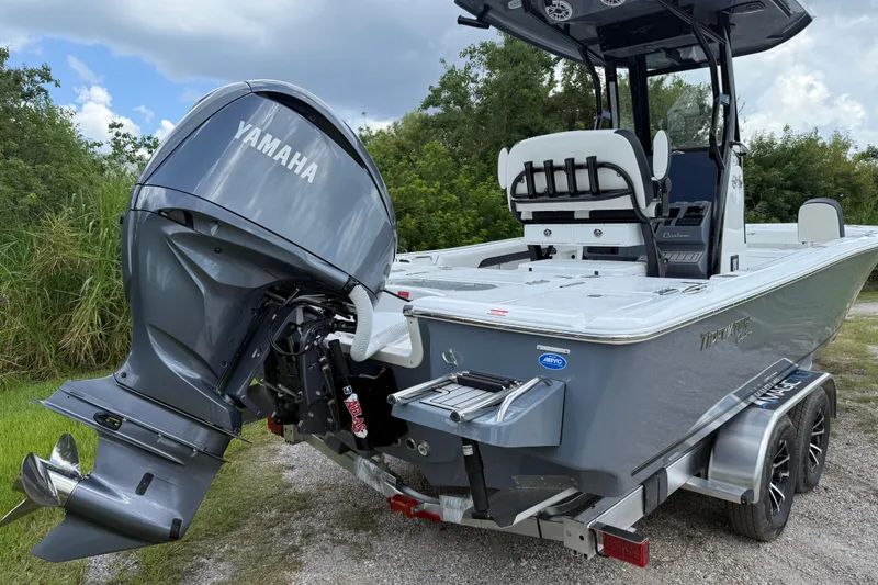 Slide: The Image of 2026 Tidewater 2500 Carolina Bay boat with Yamaha outboard engine on a trailer. - 6