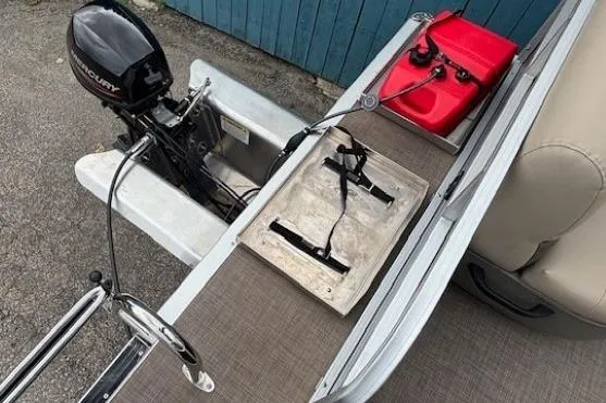 Slide: The Image of 2024 Sun Tracker Party Barge 16 DLX with Mercury outboard motor and red fuel tank. - 18