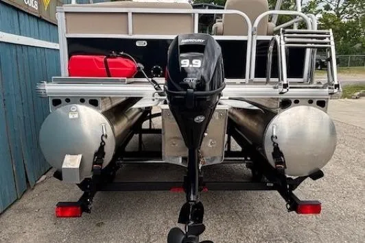 Slide: The Image of 2024 Sun Tracker Party Barge 16 DLX with 9.9 HP Mercury outboard motor, rear view. - 4