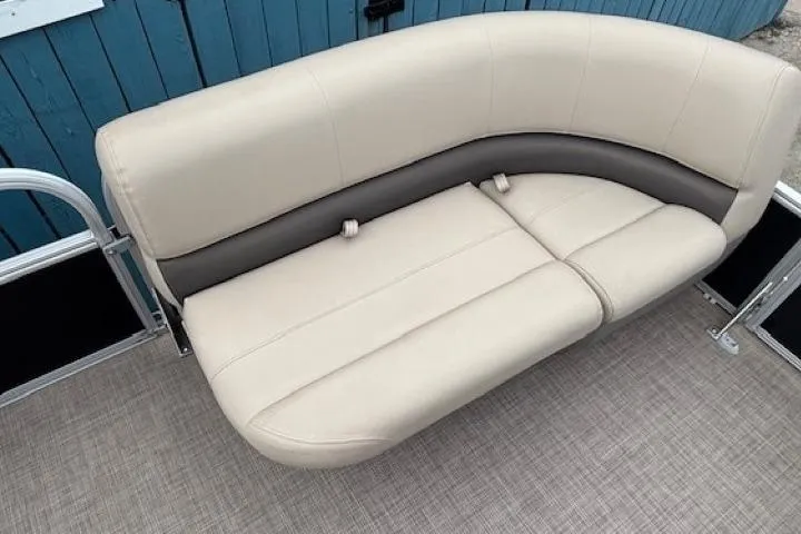 Slide: The Image of 2024 Sun Tracker Party Barge 16 DLX beige seating on pontoon boat. - 9