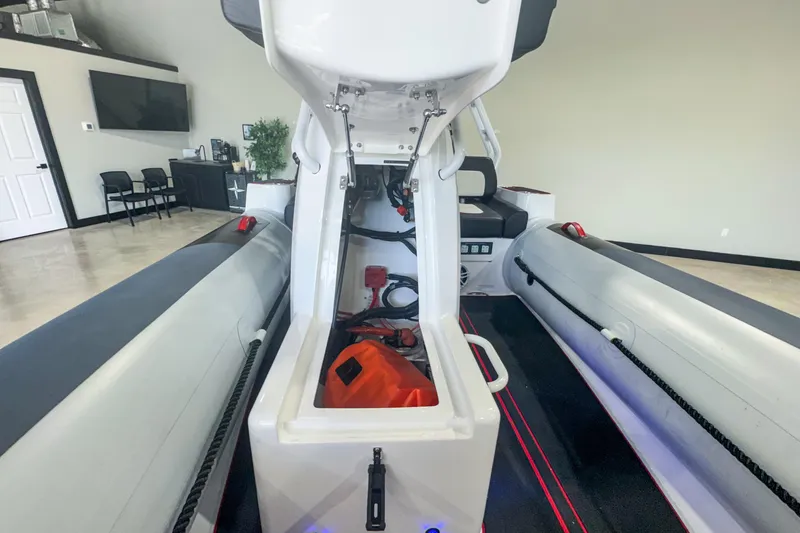 Slide: The Image of 2025 Highfield Velox 420 boat interior, showcasing storage compartment and seating area. - 12