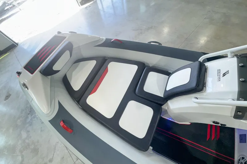 Slide: The Image of 2025 Highfield Velox 420 boat interior with cushioned seating and modern design. - 3