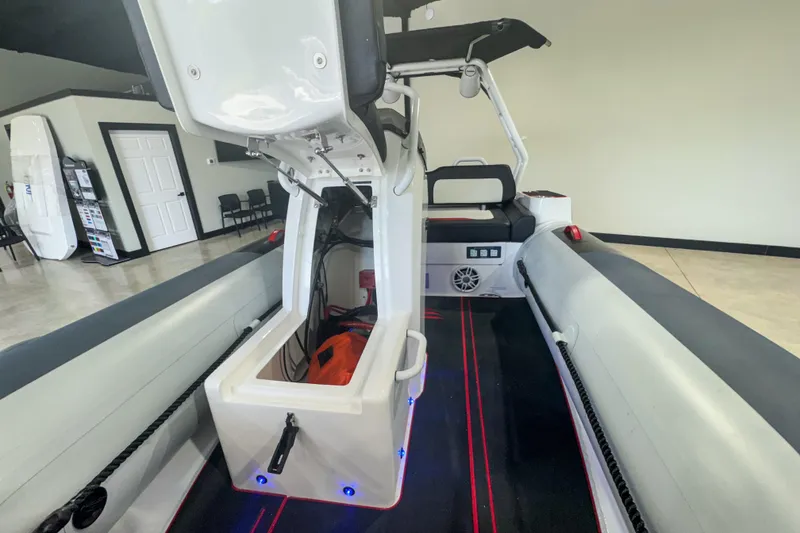 Slide: The Image of 2025 Highfield Velox 420 boat interior with open storage compartment and seating. - 5