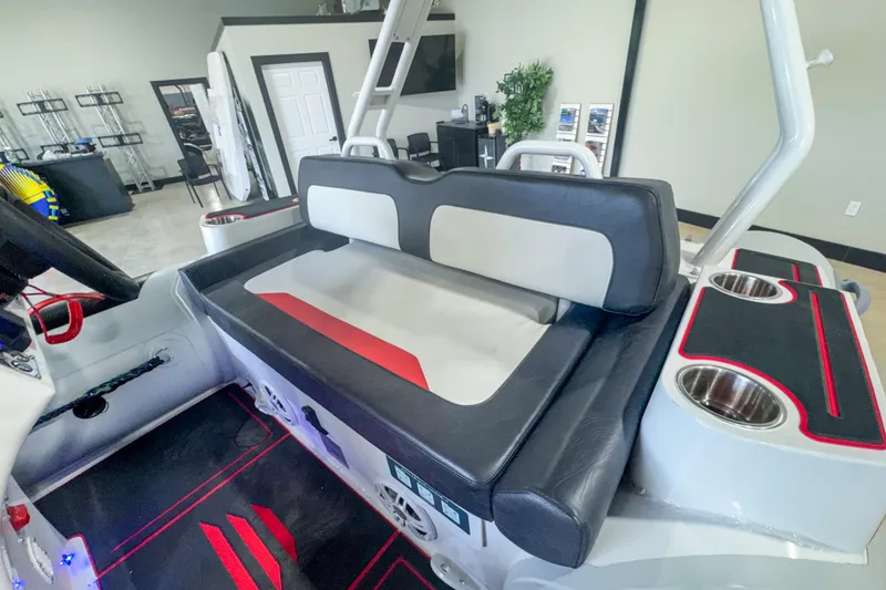 Slide: The Image of 2025 Highfield Velox 420 boat interior with cushioned seating and cup holders. - 7