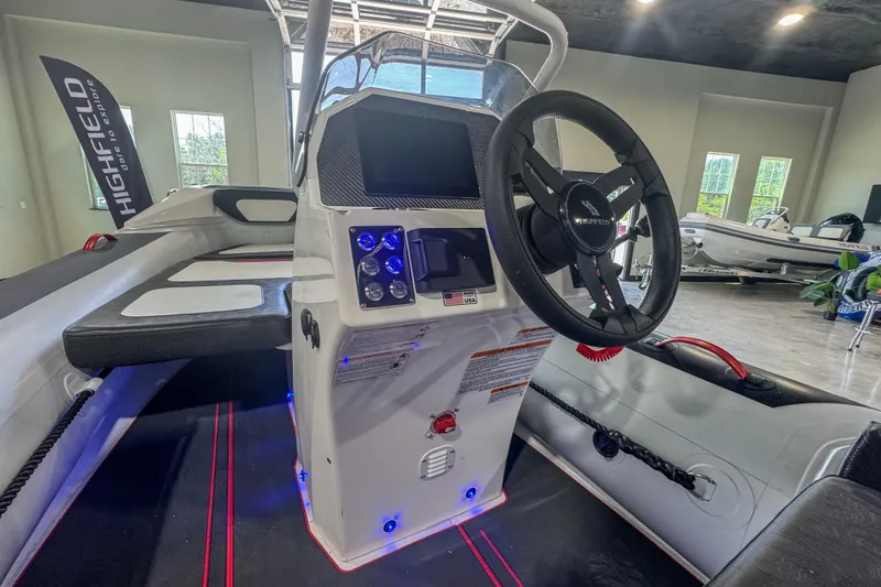 Slide: The Image of 2025 Highfield Velox 420 boat interior with steering wheel and control panel. - 8