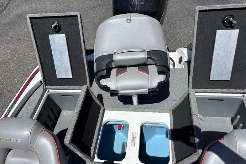 Slide: The Image of 2019 Nitro Z18 boat interior with storage compartments and seating. - 8