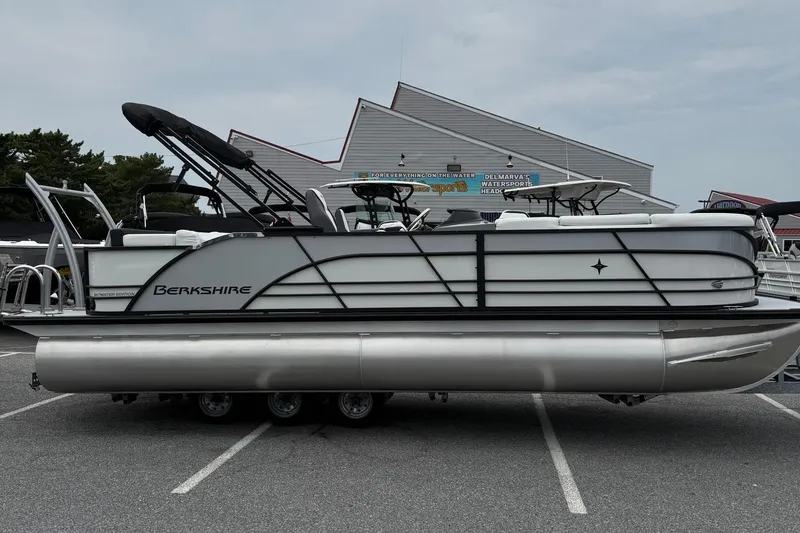 The Image of 2026 Berkshire 23CL STS 2.75 pontoon boat in a parking lot. - 1