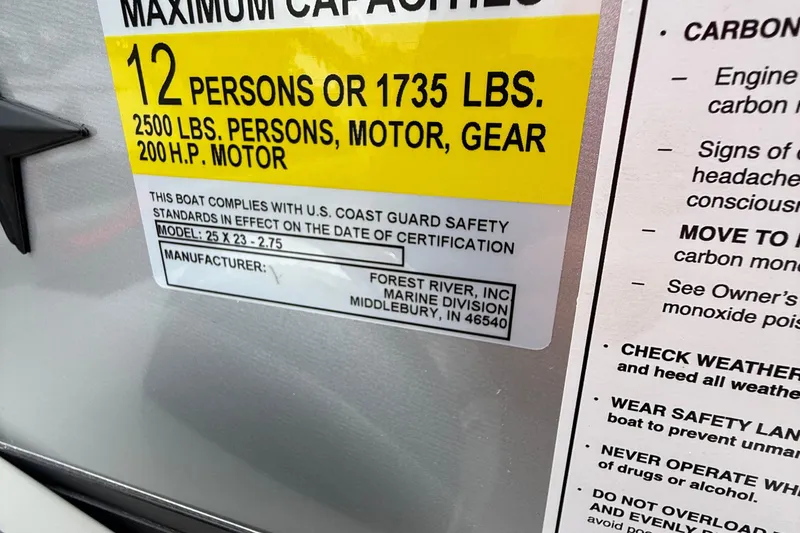 Slide: The Image of Maximum capacity label for 2026 Berkshire 23CL STS 2.75 boat, 12 persons or 1735 lbs. - 14