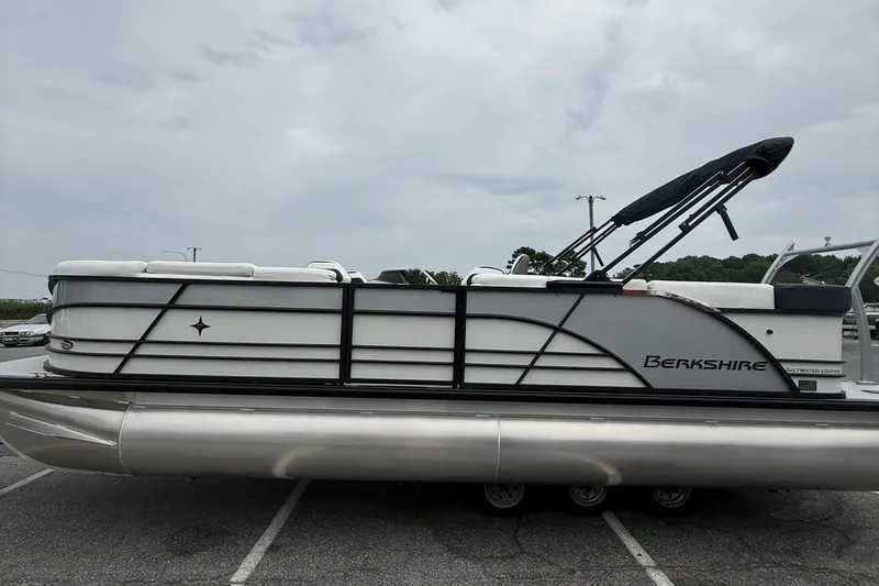 Slide: The Image of 2026 Berkshire 23CL STS 2.75 pontoon boat in parking lot, side view. - 5