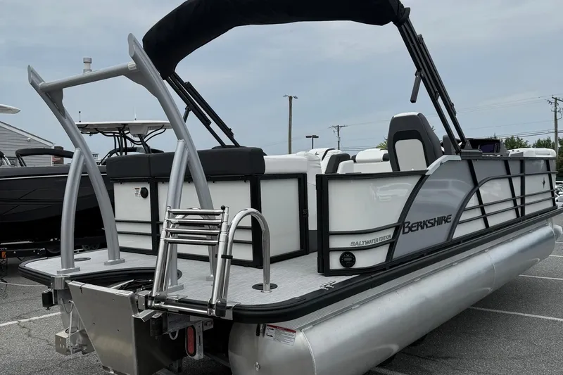 Slide: The Image of 2026 Berkshire 23CL STS 2.75 pontoon boat, saltwater edition, with sleek design and ladder. - 7