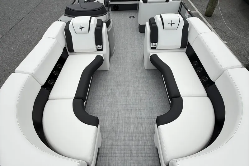 Slide: The Image of Luxurious seating on 2026 Berkshire 23CL STS 2.75 pontoon boat, featuring sleek black and white design. - 8