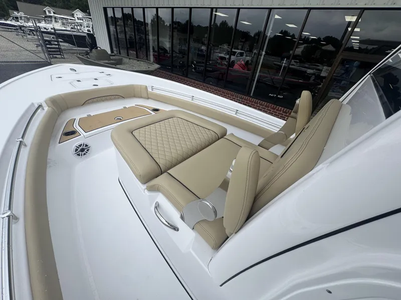 Slide: The Image of 2026 Sportsman Masters 247OE Bay Boat with beige seating and sleek design. - 13