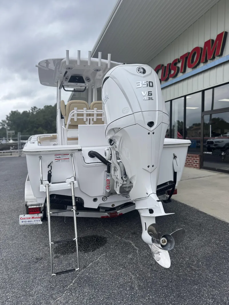 Slide: The Image of 2026 Sportsman Masters 247OE Bay Boat with Yamaha 350 V6 engine at dealership. - 15