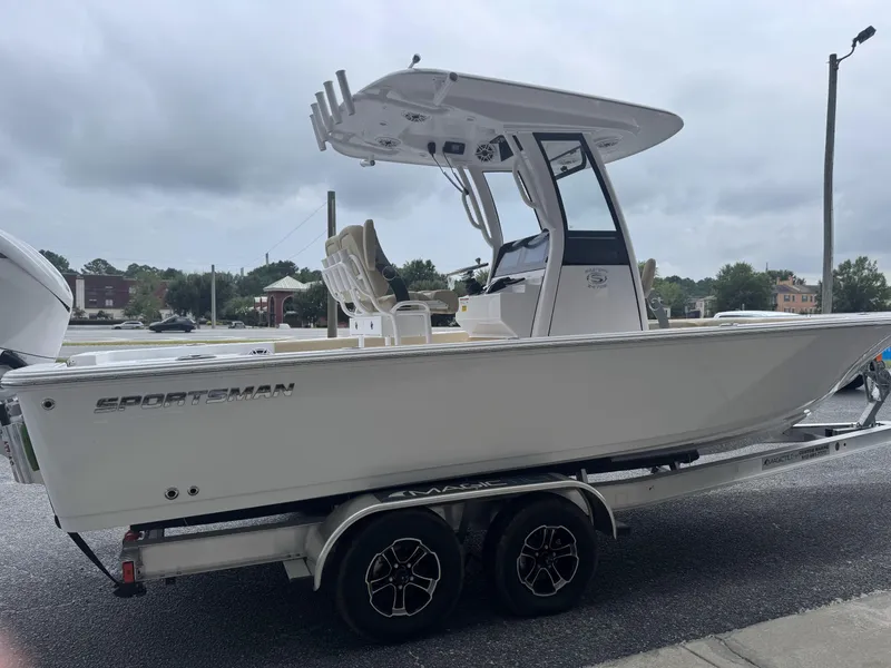 Slide: The Image of 2026 Sportsman Masters 247OE Bay Boat on trailer, side view, overcast sky. - 17