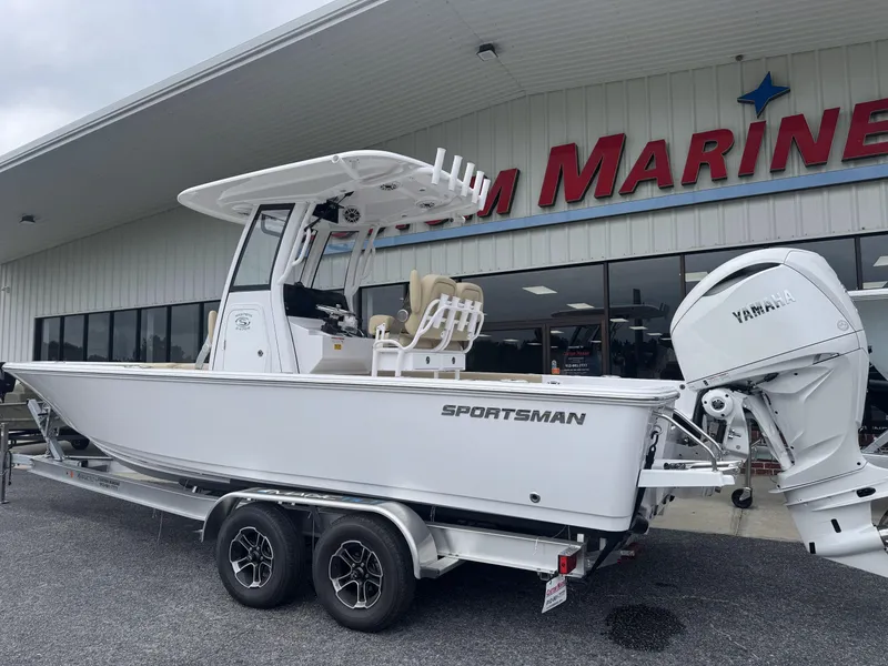 Slide: The Image of 2026 Sportsman Masters 247OE Bay Boat on trailer outside marine dealership. - 2