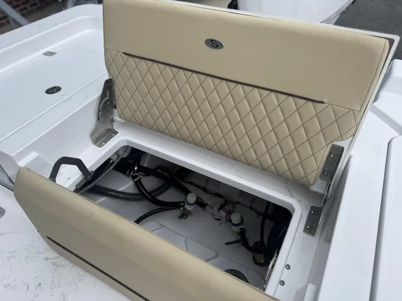 Slide: The Image of 2026 Sportsman Masters 247OE Bay Boat seat with storage compartment open. - 20