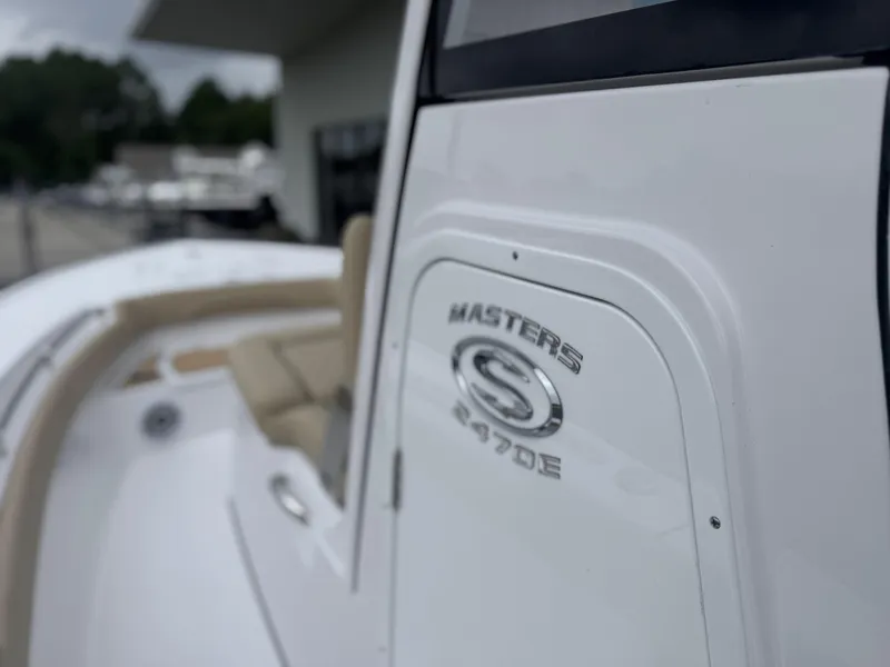 Slide: The Image of 2026 Sportsman Masters 247OE Bay Boat, close-up of logo and seating area. - 29