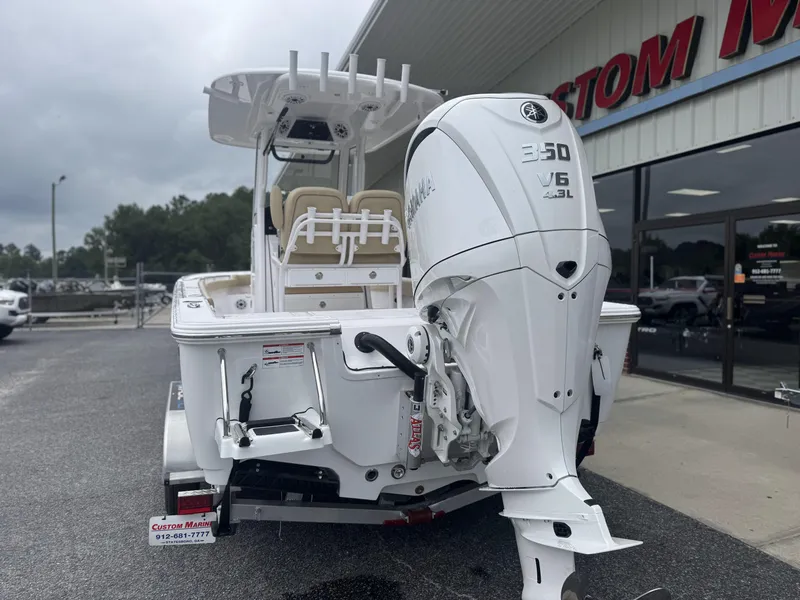 Slide: The Image of 2026 Sportsman Masters 247OE Bay Boat with Yamaha 350 V6 engine displayed outdoors. - 7