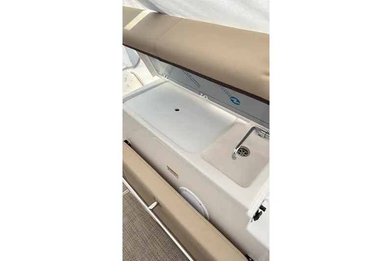 Slide: The Image of 2026 Cutwater C-248 Coupe interior with sink and cushioned seating. - 23