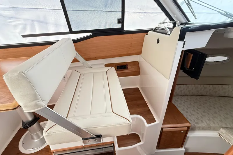 Slide: The Image of 2026 Cutwater C-248 Coupe interior with white seating and wood accents. - 41