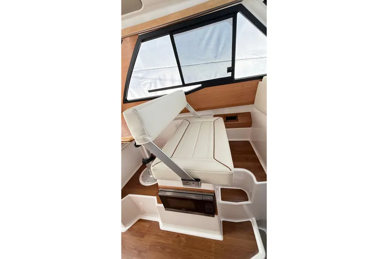 Slide: The Image of 2026 Cutwater C-248 Coupe interior with white seating and wood accents. - 42