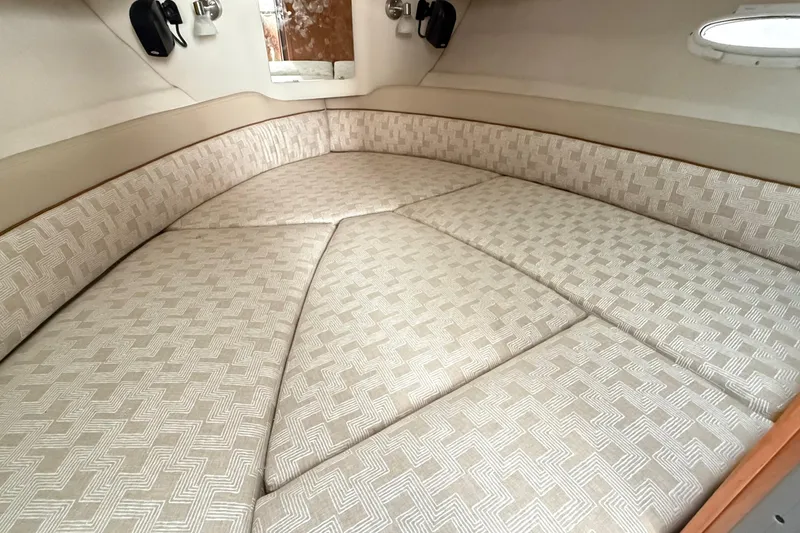 Slide: The Image of 2026 Cutwater C-248 Coupe interior cabin with patterned upholstery and cozy seating. - 51