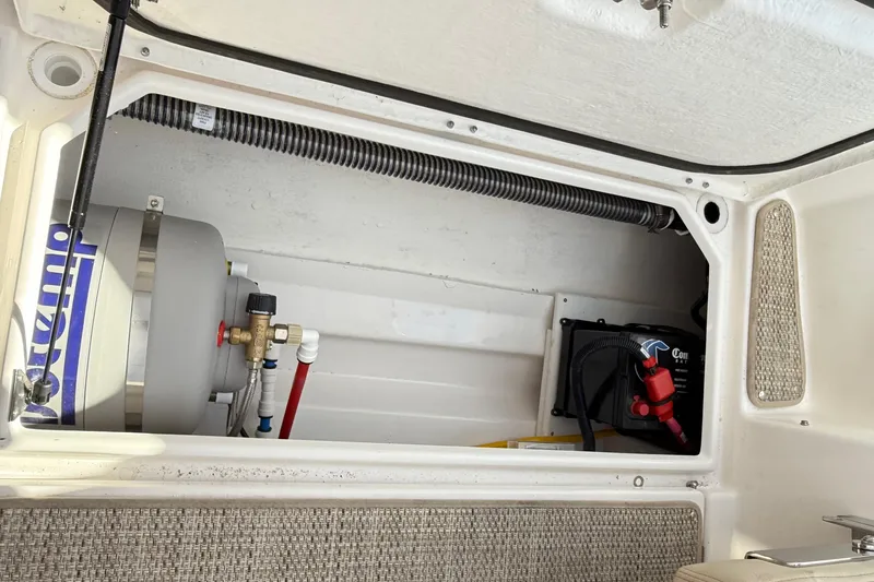 Slide: The Image of 2026 Cutwater C-248 Coupe engine compartment with water heater and battery system. - 53