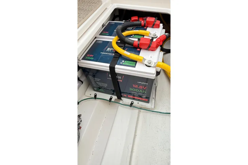 Slide: The Image of 2026 Cutwater C-248 Coupe battery compartment with 12.8V 300Ah LiFePO4 battery. - 56