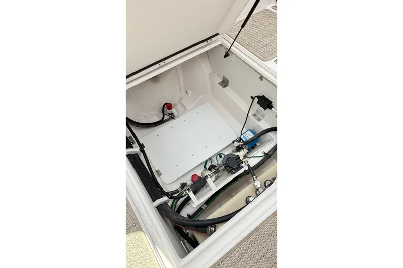 Slide: The Image of 2026 Cutwater C-248 Coupe engine compartment with visible wiring and components. - 57