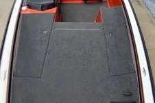 Slide: The Image of 2016 Bullet 21XRD boat interior with black carpet and red accents. - 5