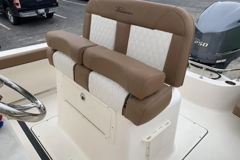 Slide: The Image of 2025 Pionee Sportfish 222 boat seat with tan and white upholstery. - 13