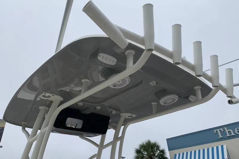 Slide: The Image of 2025 Pionee Sportfish 222 boat top view with rod holders and speakers. - 16