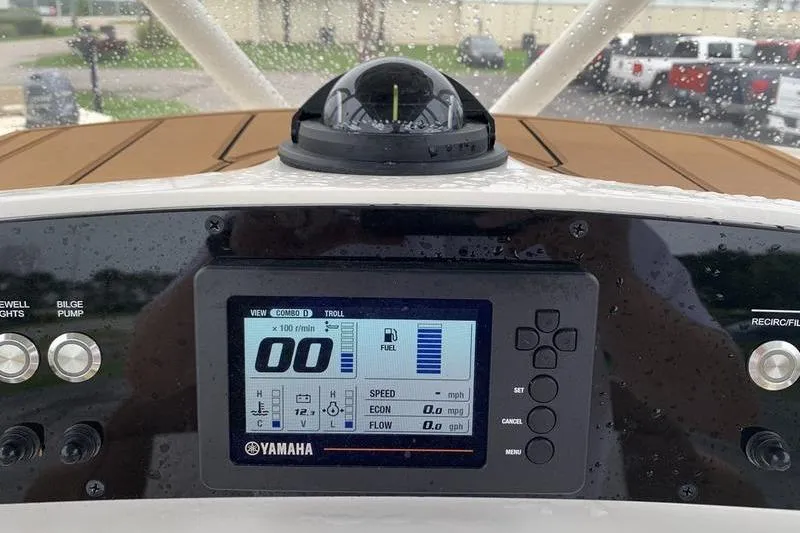 Slide: The Image of Dashboard of 2025 Pionee Sportfish 222 boat with Yamaha display and compass. - 22