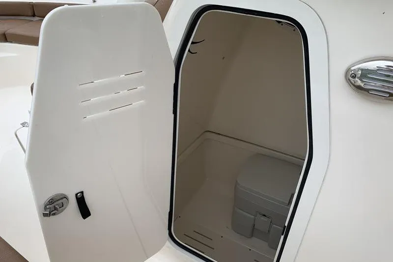 Slide: The Image of 2025 Pionee Sportfish 222 boat interior with open storage compartment. - 28